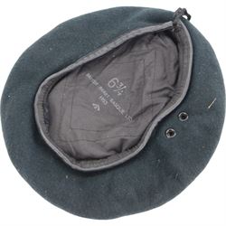 Two British Berets, fine green wool cloth with leather trim, cloth lining having makers details of “BRITISH BERET BASQUE LTD”, one with The Green Howards cap badge, together with other Green Howards buttons and badges, webbing bags and other military items