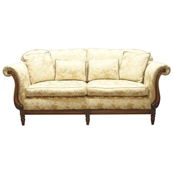  'Medallion Mendelssohn' three seat settee, upholstered in gold raised floral pattern fabric, scrolled arms with acanthus carvings, short fluted feet, W207cm  