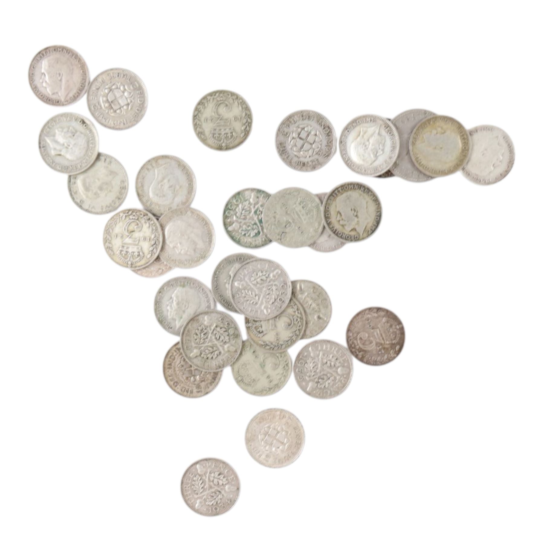 Approximately 114 grams of Great British pre-1920 and approximately 52 grams of Great Brtish pre-1947 silver threepence coins, together with a cartwheel twopence and four further coins
