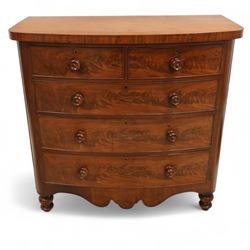 19th century mahogany bow front chest, with figured drawer fronts comprising two short over three long drawers, all with turned handles, shaped lower frieze and raised on turned supports