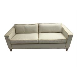 Neptune - pair three seat 'Shoreditch' sofas,  upholstered in cream fabric with yellow stringing