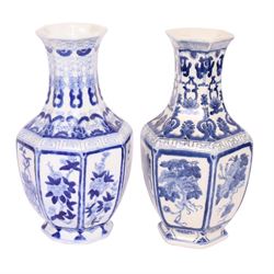 Pair of blue and white vases, of octagonal form, decorated with panels of blossoming branches, H36cm