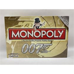 Limited edition framed James Bond 007 Skyfall print, 126/600, boxed Spectre pen, Aston Martin DB5 keyring and sealed 007 50th Anniversary Edition boxed monopoly game (4)