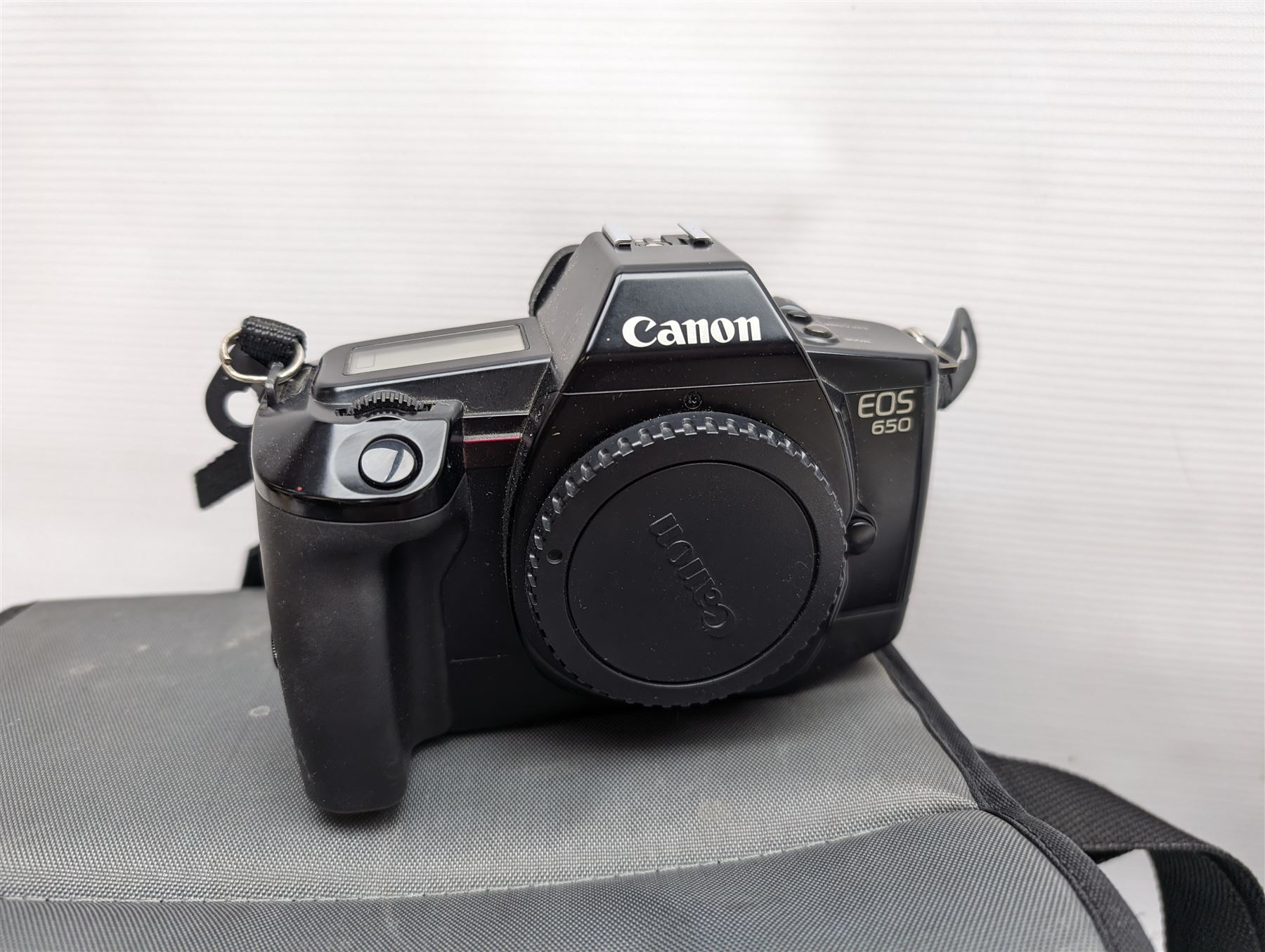 Canon EOS 650 camera, serial no 2122736, in carry case with some accessories, together with an Olympus XA2 camera and ten Kodak Instamatic cameras and two similar