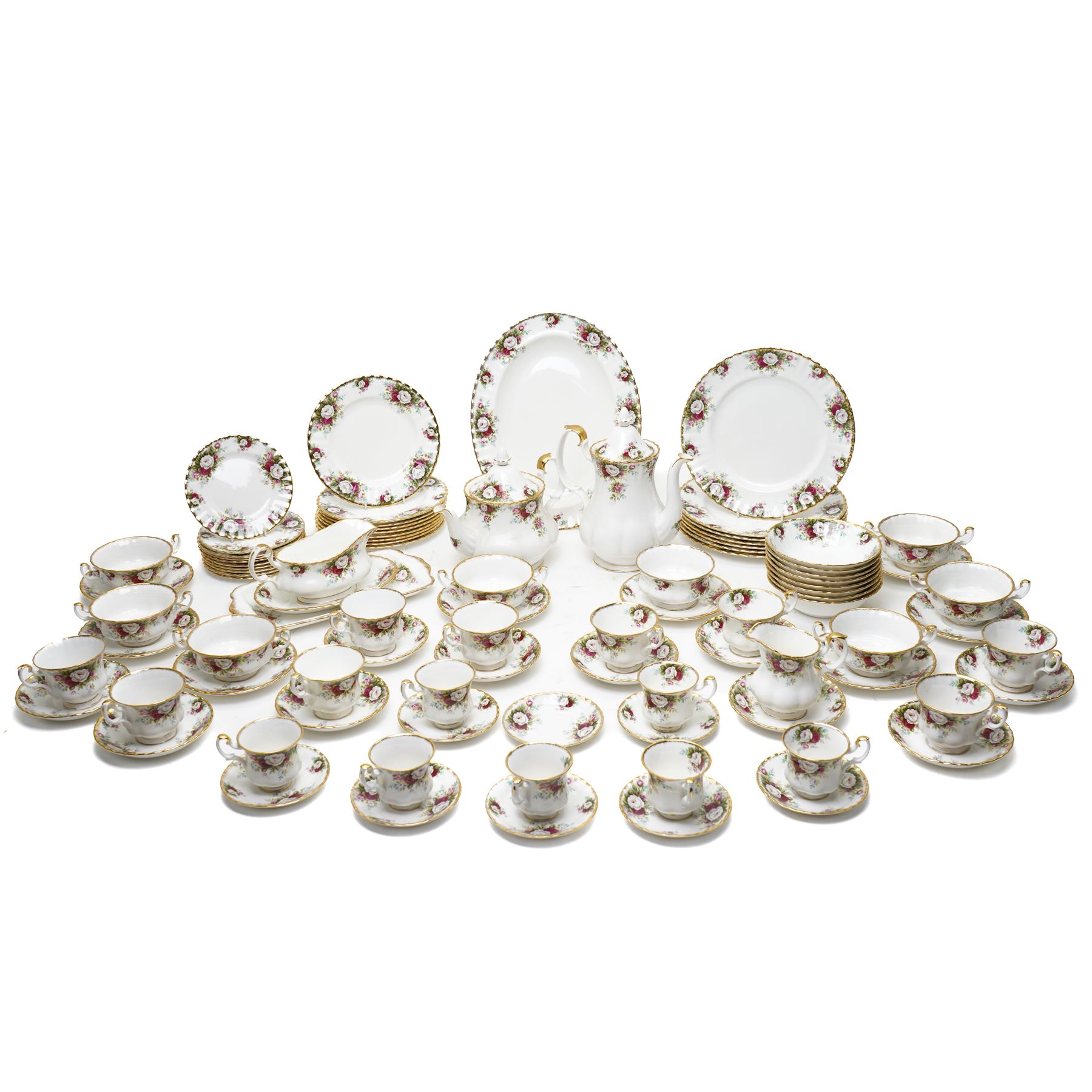Royal Albert Celebration pattern tea and dinner wares, comprising covered tea and coffee pot, seven dinner plates, oval serving dish, gravy boat and saucer, nine coffee cups and ten coffee cup saucers, seven teacups and eight teacup saucers, eight soup bowls and saucers, rectangular serving tray, ten side plates, etc, approximately 88 pieces in total