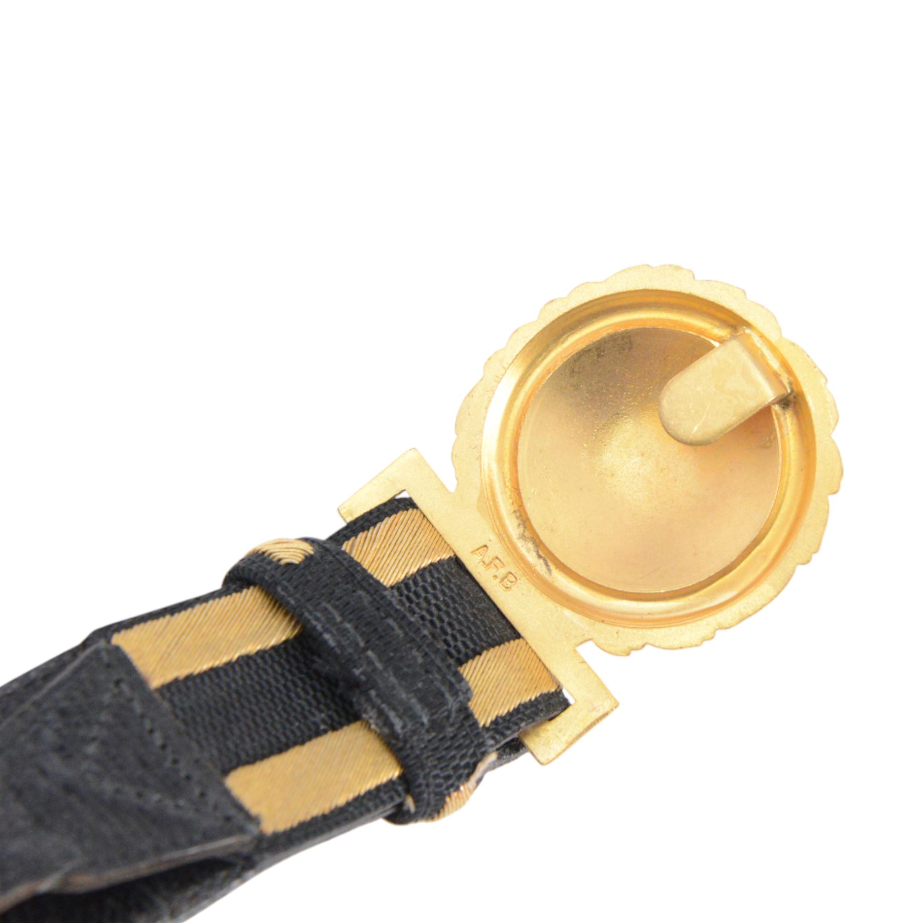 British 1827 pattern Naval officer's sword, named, by Wilkinson Sword Company in 1920 for P.H. Earle and retailed by Gives, the 80cm slightly curved blade etched to both sides, the brass guard held into scabbard by patent spring clip, lion head pommel and backstrap, with sword knot, within leather scabbard with three brass mounts, twin suspension rings and attached belt and suspension straps with gilt buckle and braid, overall L98cm 