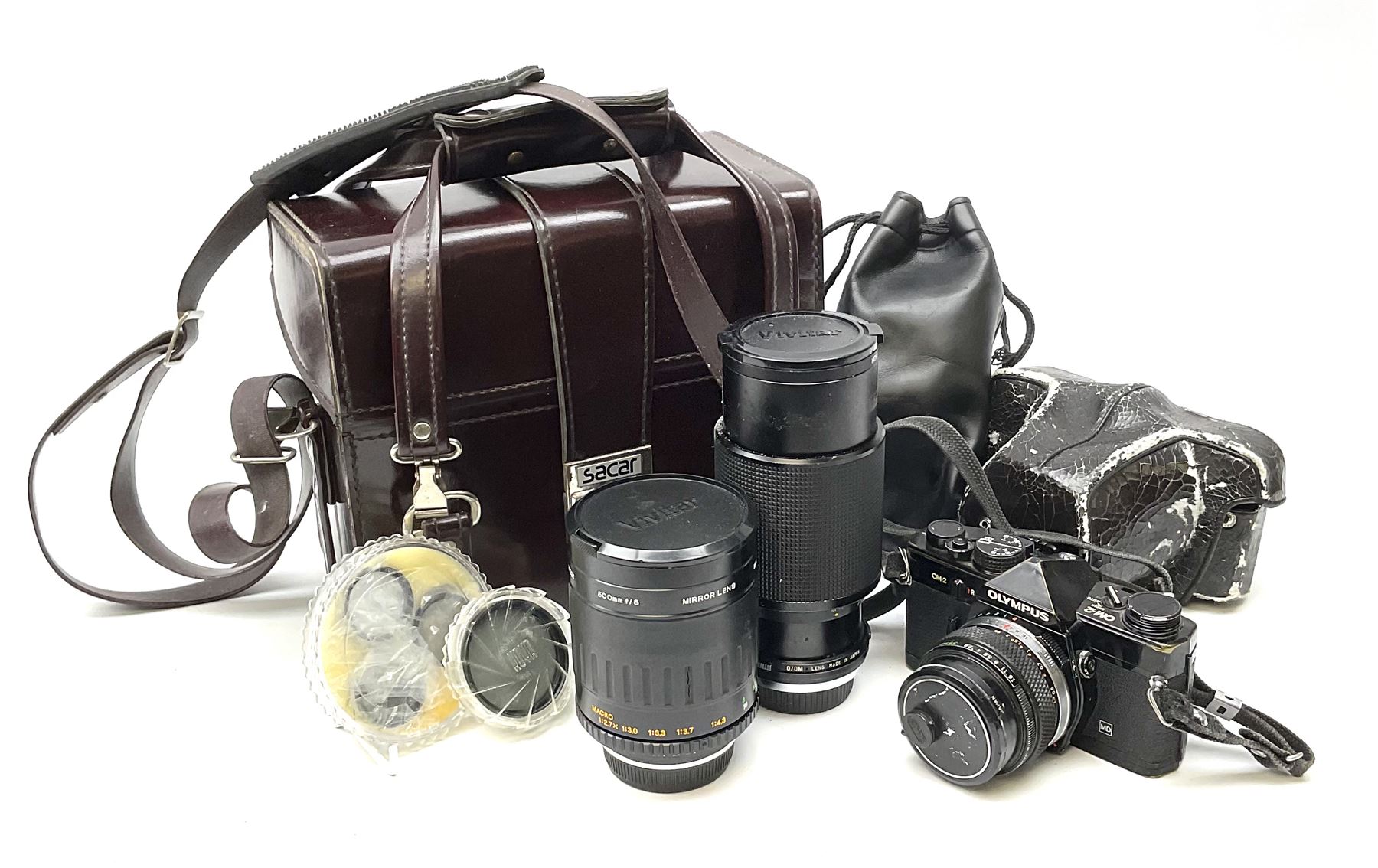 Olympus OM2 camera, 'no.264258', fitted with Olympus 'OM System G.Zuiko Auto-W 1:2.8 f35mm' lens and two other lenses, in a carry case