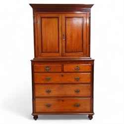 George III oak and mahogany banded house keeper's press cupboard, projecting cornice over figured mahogany frieze with Tunbridge ware pattern bands, two panelled doors enclosing shelves, fitted with two short over three long drawers, flanked by reeded columns throughout, on turned feet