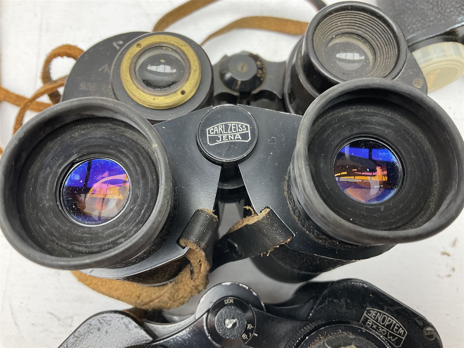 Twelve pairs of binoculars to include BWCF 7x35 Extra Wide Angle, Carl Zeiss Jena Delturis 8x24, Carl Zeiss Jena Jenoptem 8x30W, Chinon Countryman 10x50,  Ajax 8x30, Regent 16x50, etc,  some with cases