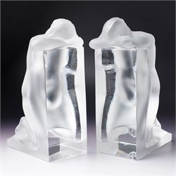 Pair of Lalique 'Reverie' glass bookends formed as two kneeling nude figures in clear and frosted glass inscribed 'Lalique France' to the plinth base H23cm