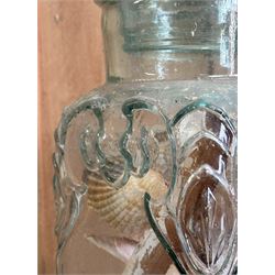 Early 20th century moulded glass confectionary jar with cartouche and scrolled decoration, containing a collection of seashells (H35cm) together with another confectionary jar with seashells inside (H20cm) an early 20th century etched glass fly catcher, and a large seashell (4)  - COLLECTION BY APPOINTMENT FROM: The White House, Thirsk Road, Easingwold, York, YO61 3NF - CALL 01723 507111 TO ARRANGE