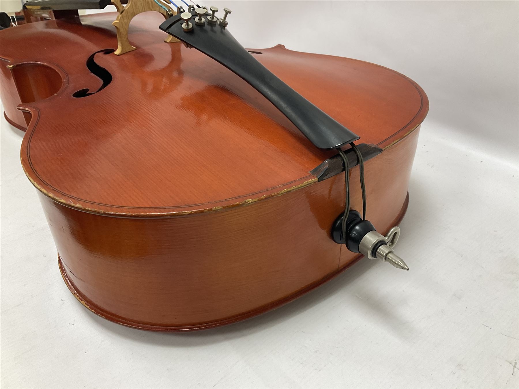 3/4 size cello with soft case, 69cm back length, 114cm full length, with bridge, ebonised tail piece and fingerboard.