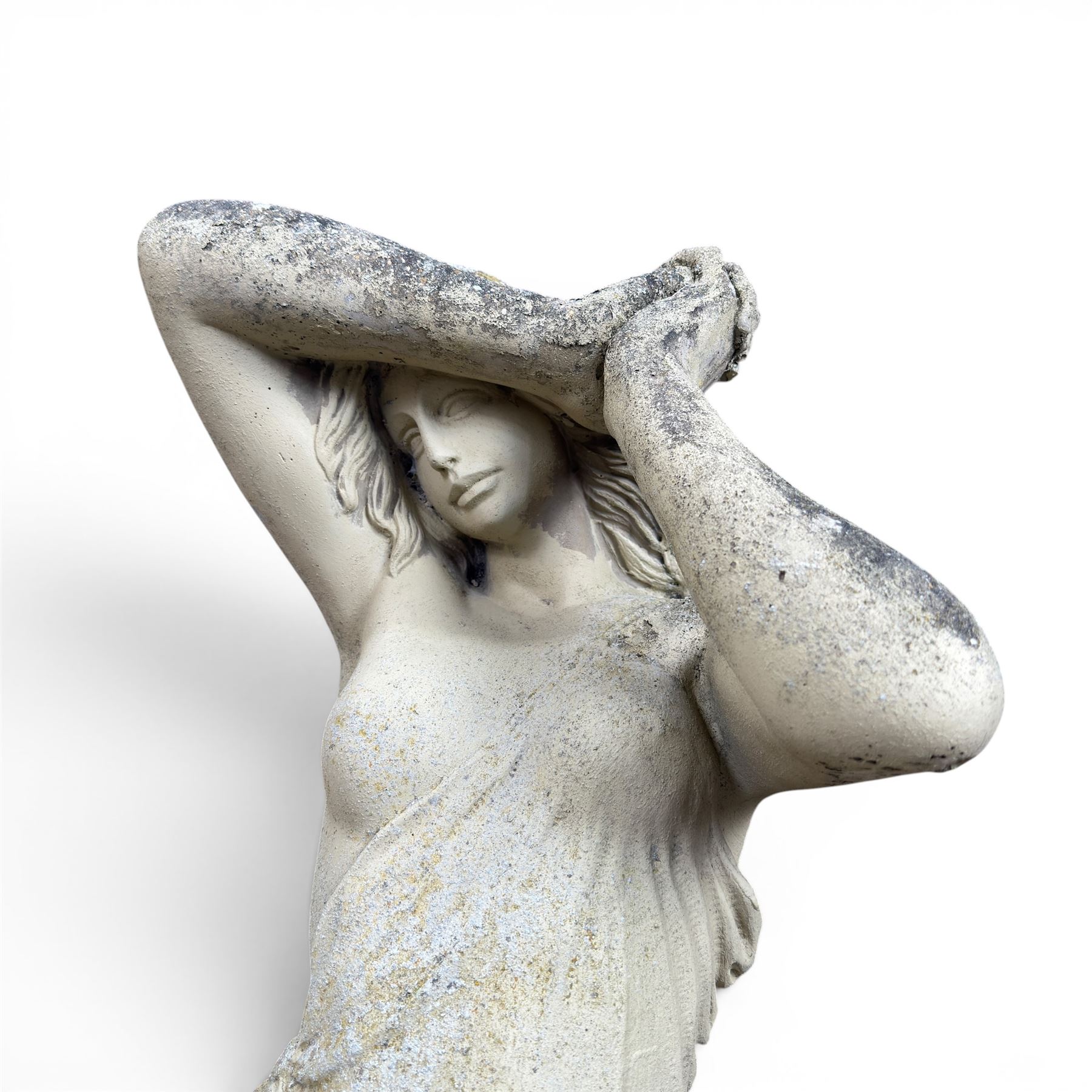 Composite stone garden figure of a scantily clad lady