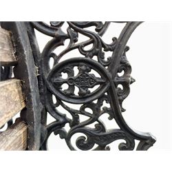 Victorian Andrew McLaren pattern cast iron bench, the ornate ends with detailed scrollwork, joined together with a cast iron seat and backrest frame supporting gently weathered oak slats, Victorian diamond stamp mark