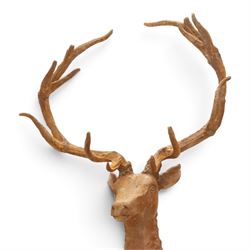 Pair of cast iron stags, upon a on moulded rocky plinth, standing alert 