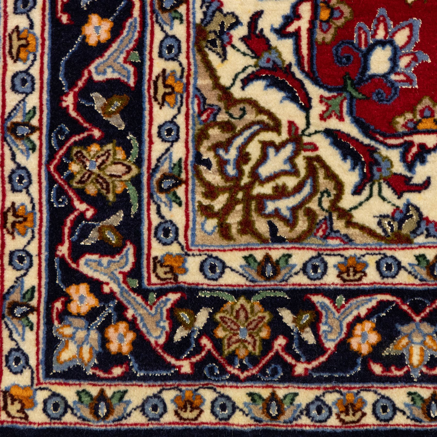 Two Central Persian rugs, ivory ground with a symmetrical foliate and floral design around a shaped cartouche medallion with a red floral and bird motif border with contrasting guard stripes, 142x76cm, Central Persian Kashan rug, crimson central field with a floral and foliate design with a stylized rosette medallion incorporating palmettes and scrolling vine work, enclosed by a dark navy border and multiple guard stripes, 117x68cm, (2)