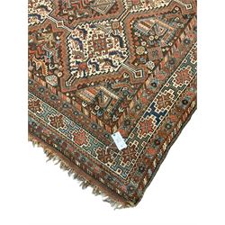 Persian rug, overall geometric design, the field with six interlinked lozenge medallions surrounded by stylised animal and geometric motifs, multiple band border with geometric patterns 