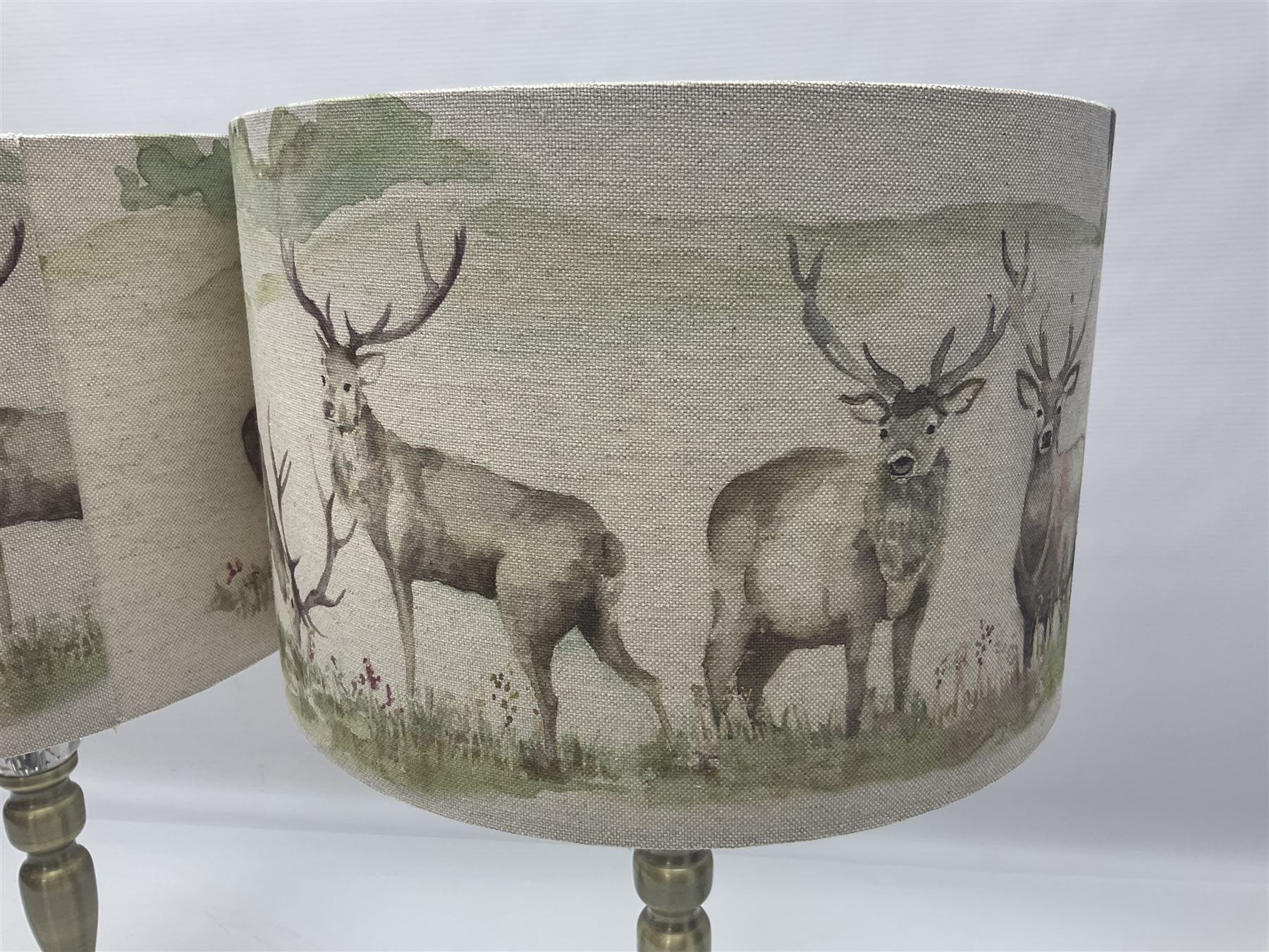 Pair of table lamps, with fabric shades decorated with deer, in a water colour style, H47cm, shades D30cm