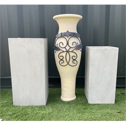 Graduating pair concrete effect square planters (largest - 34cm x 34cm, H71cm), and a tall garden urn planter with scrolled metalwork mount (H93cm) - THIS LOT IS TO BE COLLECTED BY APPOINTMENT FROM DUGGLEBY STORAGE, GREAT HILL, EASTFIELD, SCARBOROUGH, YO11 3TX