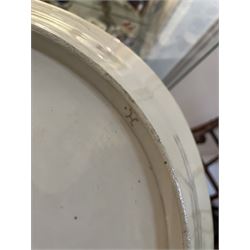 Large and impressive 18th century Meissen dish, finely painted with a chinoiserie scene to a central shaped reserve, depicting figures and attendants engaged in various pursuits, the reserve with gilt scrollwork edge, filled with Böttger lustre and detailed with iron red scrollwork, surrounded by flower heads, the rim with four quatrofoil Kauffahrtei scene panels of merchants and figures by a quayside in purple monochrome, with gilt scroll border, with under glazed blue crossed swords mark, and gilt gilders mark, D39cm
