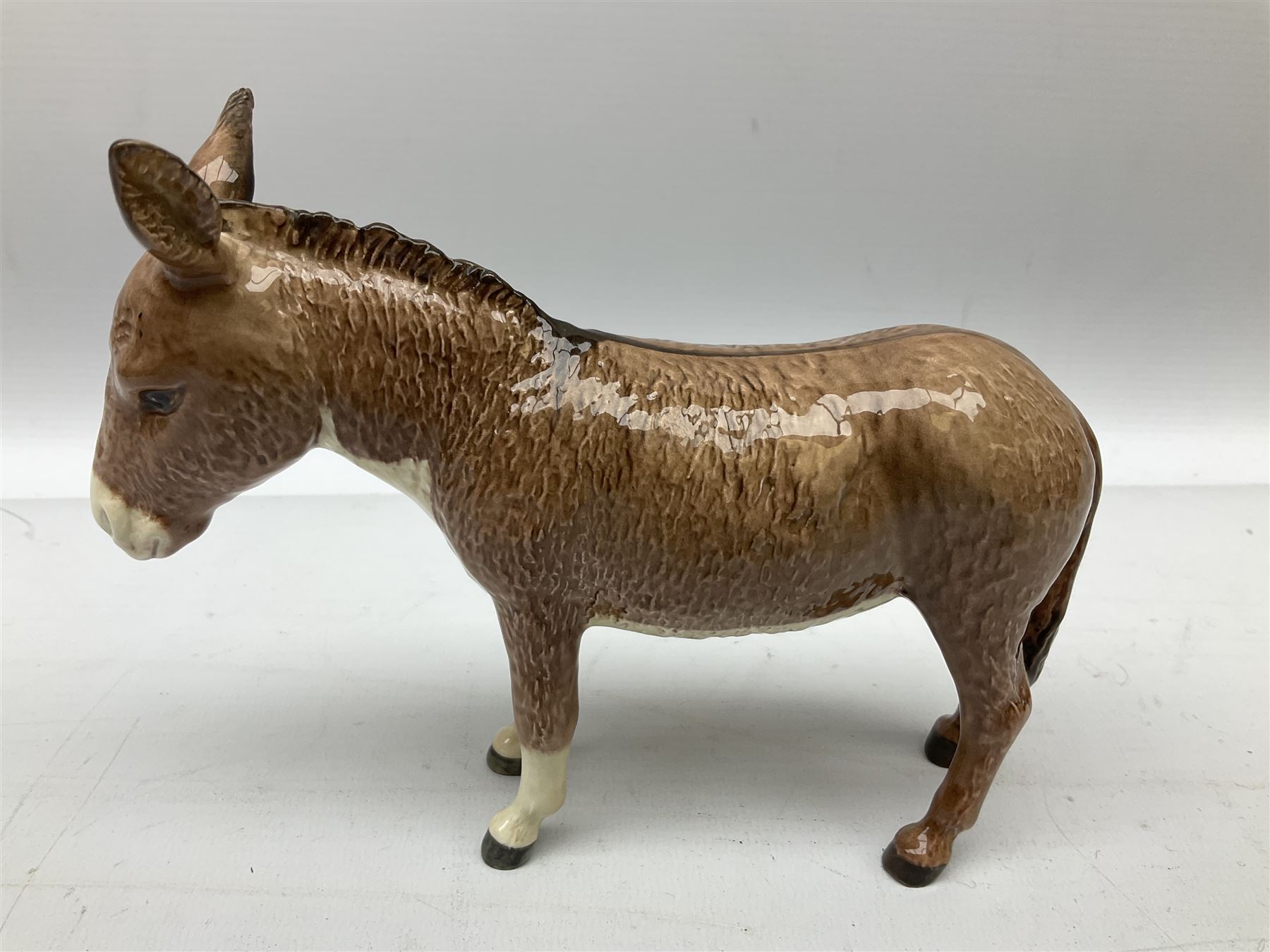 Beswick donkey family to include no.1364b, no.2267a, another donkey and donkey foal (4)