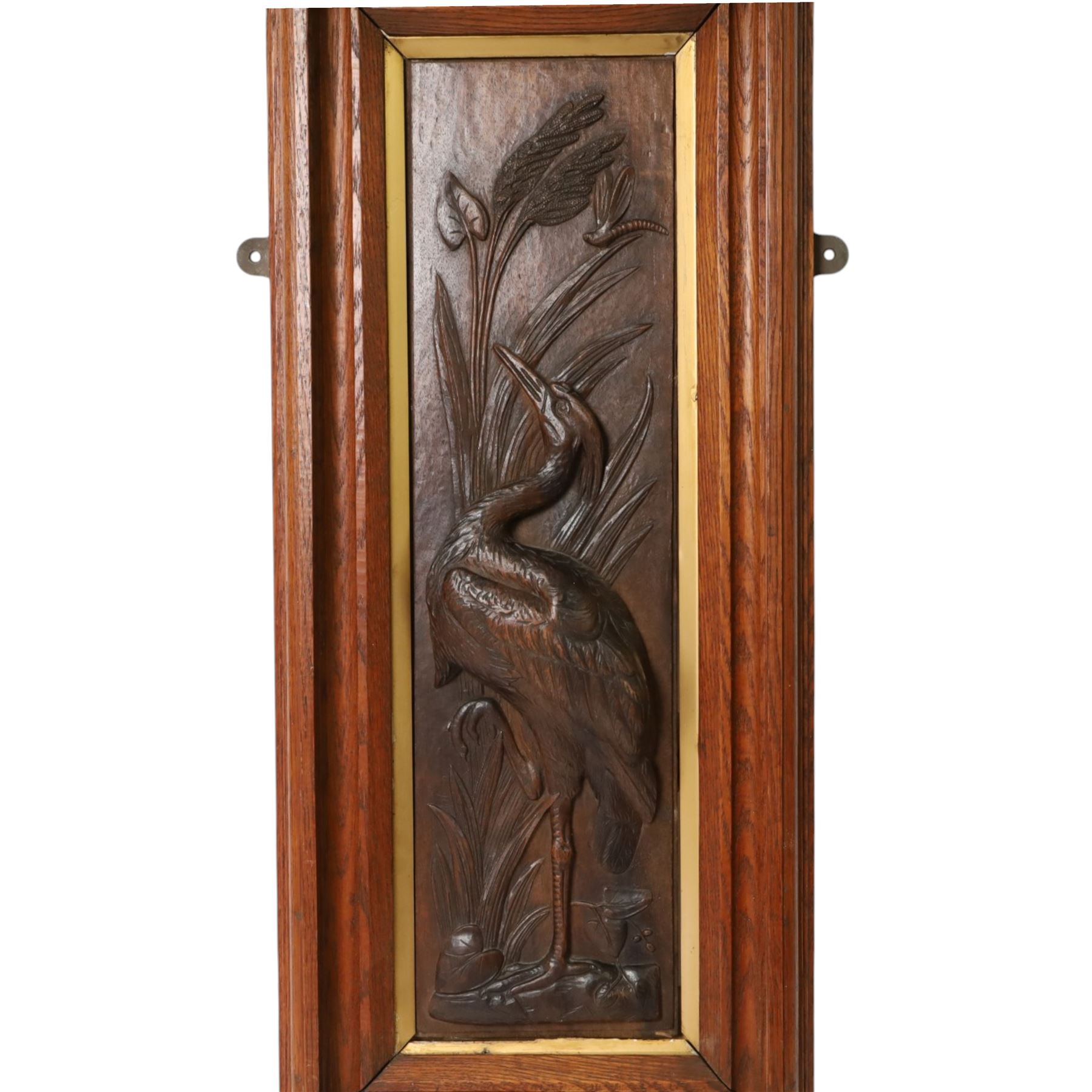 After Leander Plummer II, carved wooden panel of a stork amongst reeds, within a wooden frame, H80cm
