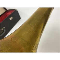 Three brass trombones comprising Elkhart Ind. USA 'CONN' model no.72H; Besson 'Concord'; and Selmer Distributed 'Lincoln'; two in carrying cases; and German B & M 'Champion' brass trumpet (4)