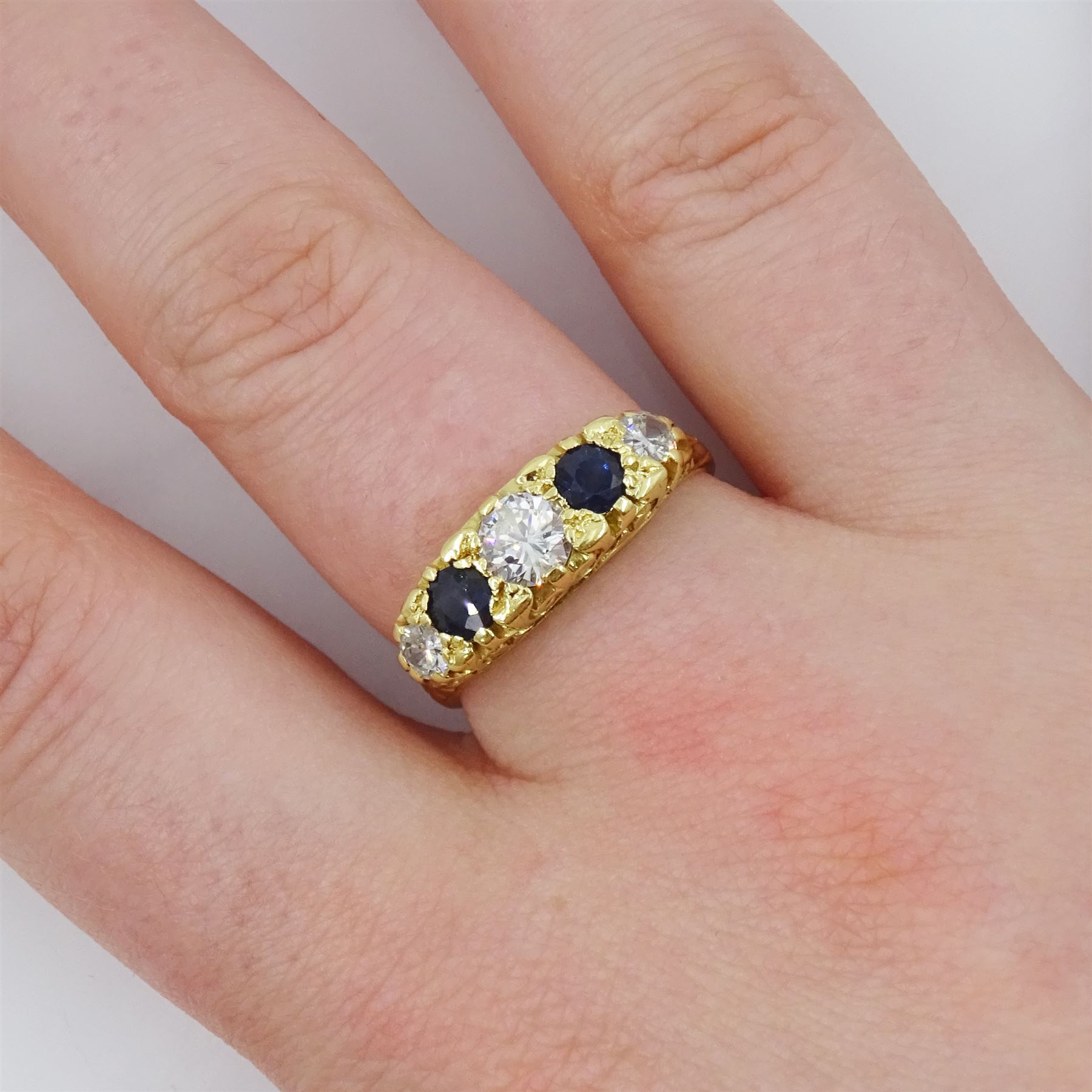 18ct gold five stone round brilliant cut diamond and sapphire ring, London 1975, total diamond weight approx 0.60 carat
