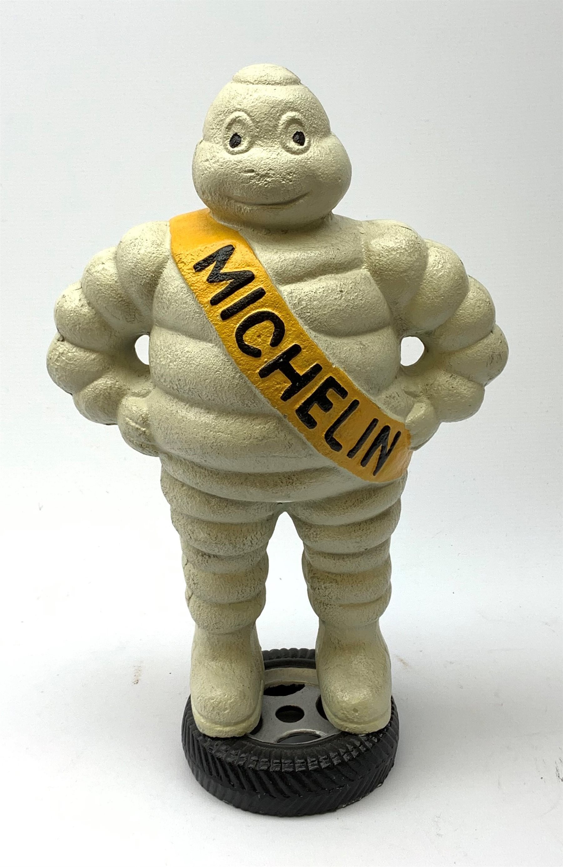 A cast iron Michelin man, H38.5cm. 