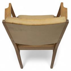 Gordon Russell - mid 20th century teak dining suite, comprising rectangular extending dining table and six matching chairs including one carver, each chair with padded upholstered seat and backrest in vinyl, on square supports, the table with plain top and rounded edges on tapered legs, an example of the firm’s functional post-war design with restrained modernist detailing (Chairs H 85cm, W 47cm, D 46cm) (Extends to 154cm)