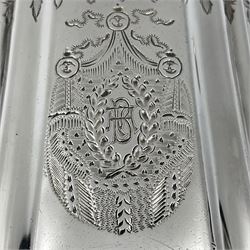 Victorian three-piece silver tea service, comprising teapot, twin handled open sucrier and milk jug, of oval form with shaped rim and C handles, each engraved with crests and bands of strapwork decoration, the milk jug and sucrier with gilt interiors, hallmarked Josiah Williams & Co, Exeter 1881, the teapot with ivory insulators and finial, all contained with a tooled leather, blue silk and velvet lined fitted case, retailed by West & Sun, Dublin 
This item has been registered for sale under Section 10 of the APHA Ivory Act