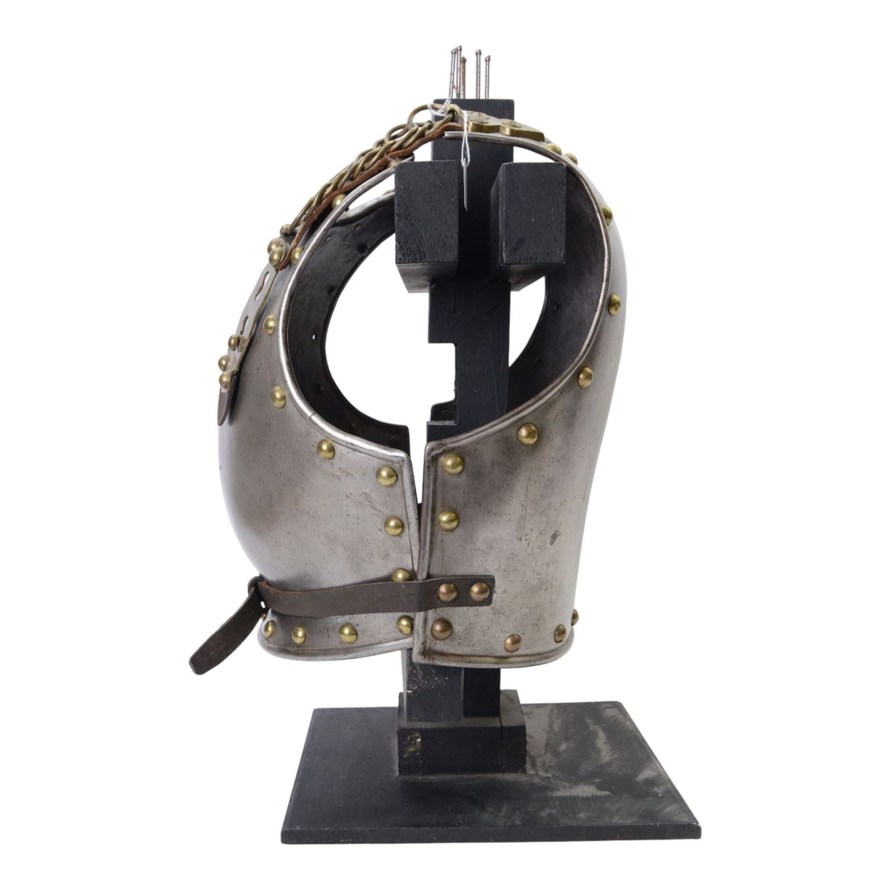 Napoleonic Belgium Cuirassier breast and back plate, circa 1814, with raised medial ridge and shallow apron, rolled edge and brass studded decoration, the shoulder chains secured by chest studs, H40cm