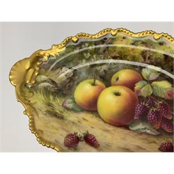 Early 20th century Royal Worcester dish decorated by Thomas Lockyer, oval form with gilt shaped rim and twin shell handles, hand painted with a still life of fruit upon a mossy ground, signed T Lockyer, with puce printed mark beneath and date code for 1922, W31cm
