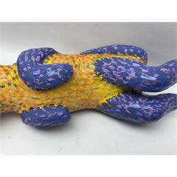 Helen Skelton (British 1933 – 2023): Two carved wooden abstract sculptures, one modelled as a dog, the other modelled as a bear, both with painted stippled decoration, largest H20cm. Born into an RAF family in 1933 in Kent and travelled the world extensively during her childhood. After settling in Bridlington, Helen immersed herself in painting, textiles, and wood sculpture, often inspired by nature's beauty. Her talent was showcased in a one-woman show at Sewerby Hall and recognised with the sculpture prize at Ferens Art Gallery in 2000. Sadly, Helen’s daughter passed away from cancer in 2005. This loss inspired Helen to donate her sculptures to Marie Curie upon her passing in 2023.