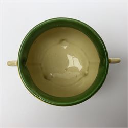Clarice Cliff Bizarre for Newport Pottery, small bowl in the form of cauldron painted in the Crocus pattern, bordered by brown and yellow banding, with angular handles and raised upon three peg feet, with green printed mark and painted CROCUS beneath, circa 1929, H7cm