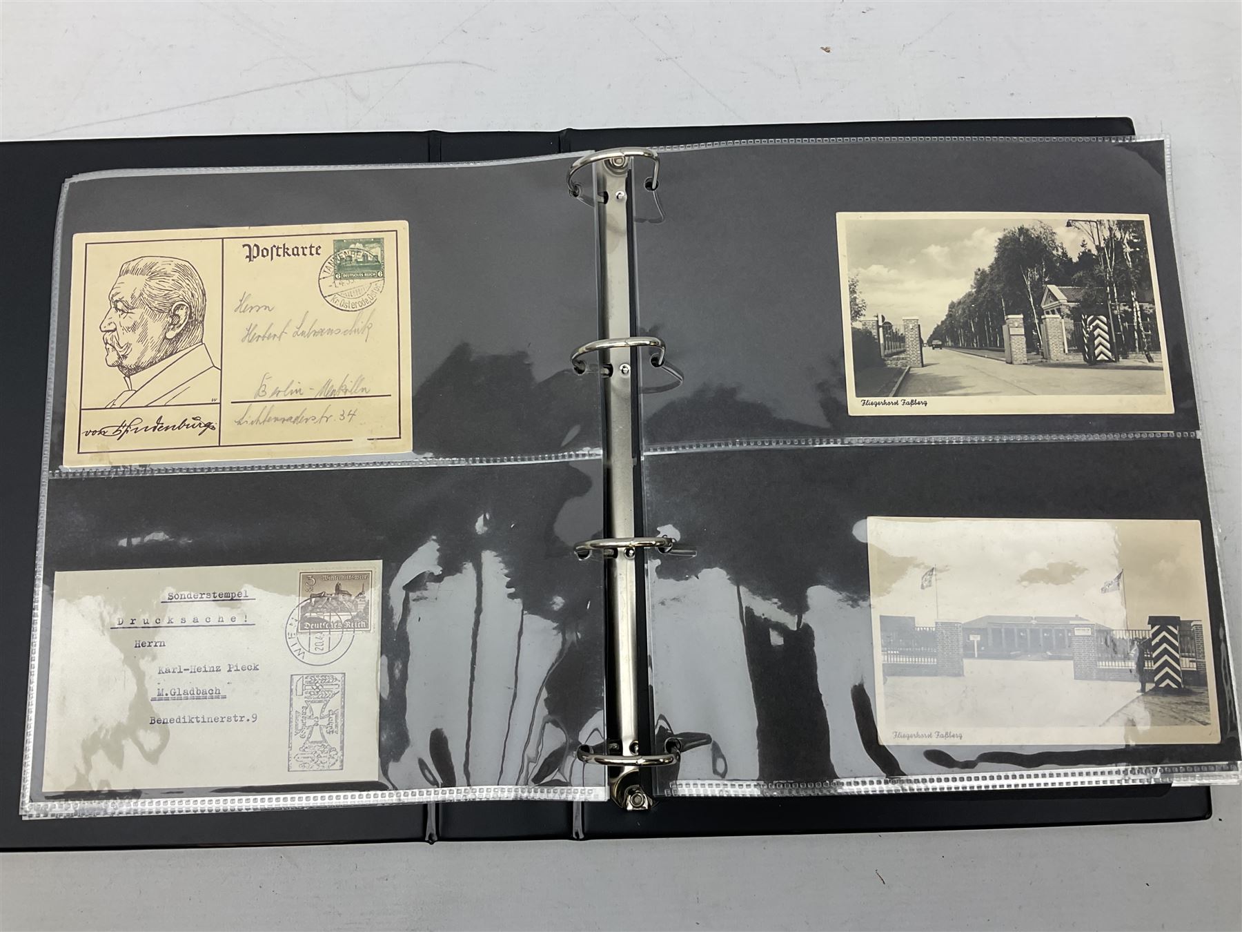 Modern loose leaf album of WW2 German postcards, photographs and other paper ephemera including Adolf Hitler, Luftwaffe, comic, soldier and group portraits, memorial cards, propaganda images, interesting postmarks etc