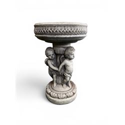 Cast stone cherub bird bath, circular removable top raised on three cherubs with ornate detailing
