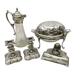 Victorian silver plate mounted cut glass claret jug, the tapering body with hobnail cut and etched floral decoration and star cut base, the mount with mask spout, together with silver plated food warmer with twin handles and domed revolving lid opening to reveal a lift out pierced tray, stamped Goldsmiths Company beneath, together with hobnail cut and etched glass claret jug with floral decoration, pair of ornate silver plated candlesticks and desk stand with glass inkwell, claret jug H30cm