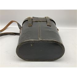 Pair of WWII German U-boat binoculars probably 7 x 50 by Leitz, with rubber eye piece protector covers and leather case stamped with Kriegsmarine mark to the lid and dated 1944, with leather strap.