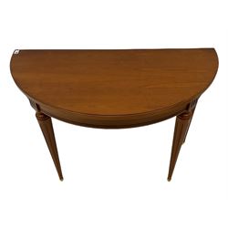 Contemporary cherry wood demi-lune console table, on tapering turned supports with fluting