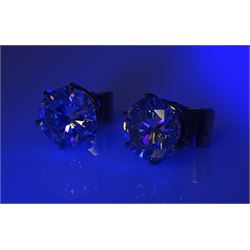 Pair of platinum round brilliant cut diamond stud earrings, Birmingham 1981, total diamond weight 5.00 carat, VS1-VS2 clarity, colour K, with World Gemological Institute certificate