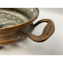 Agricultural copper corn funnel, H32.5cm, another similar copper funnel and copper warming platter of oval form, with twin handles on four supports, with removeable warming plate, L49cm