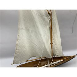 Wooden model of a schooner together with another similar example, largest example 48cm