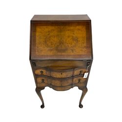 Early 20th century mahogany and walnut bureau, fall-front top enclosing fitted interior over two drawers, raised on cabriole supports