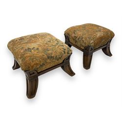 Pair of early 20th century miniature footstools, square seat covered in gold and orange floral patterned tapestry fabric, on carved wooden frame with splayed supports 
