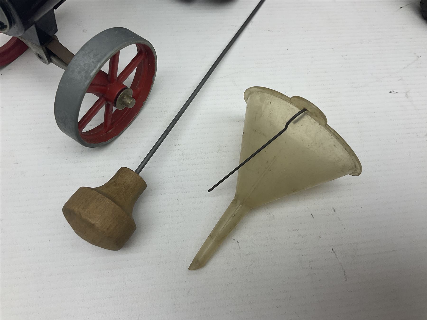 Mamod TE1a steam traction engine with burner, bunker, steering rod and funnel; red and black painted Tri-ang tin-plate Jones KL44 mobile crane; and two Hull Savings Bank Home Safe money boxes; all unboxed (4)