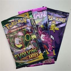 Collection of modern Pokemon TCG trading cards from the Scarlet & Violet and Sword & Shield eras, contained within in two folders, opened packets and loose, together with a graded Sword & Shield Silver Tempest Passiman TG08, GET Graded 9 Mint, two oversized cards, energy cards, vintage booklets and boxes, empty tins, 1998 Electronic Pokédex and other accessories