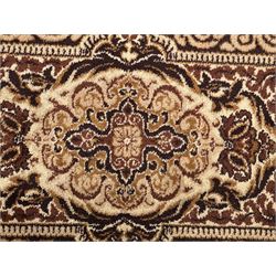 Persian Tabriz ivory ground rug, the field centred by a shaped floral medallion with swirling spandrels, richly decorated with foliate motifs, the broad border with matching cartouches and palmettes, within multiple guard stripes