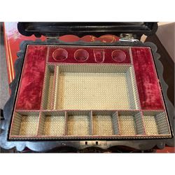 Victorian black lacquered papier-mâché sewing box, of rectangular form with shaped sides, the slightly domed top with inlaid mother of pearl and abalone decoration, the sides with gilt and polychrome painted scrollwork, the hinged cover opening to reveal a fitted interior with lift out tray, H14cm