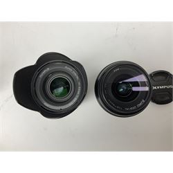 Three Olympus Camera bodies, comprising of OM-D E-M5, E-400 and E-450,   together with 'Samyang Mirror Lens 800mm 1:8.0DX', Olympus 'Zuiko Digital 40-150mm 1;3.5-4.5mm' lens, three other lenses and Velbon CX444 tripod 